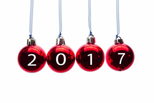 Four red christmas balls with new year 2017 numbers isolated on white background