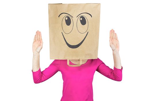 Woman wearing paper bag with happy facial expression on head isolated on white background