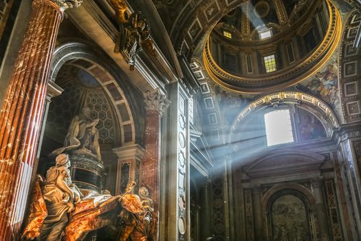 Vatican, Italy - June 26, 2014: The sun's rays pour at the interior of the Saint Peter Cathedral in Vatican. 