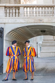 Vatican, Italy - June 26, 2014: Members of the Pontifical Swiss Guard stand guard in Saint Peters Basilica in Vatican