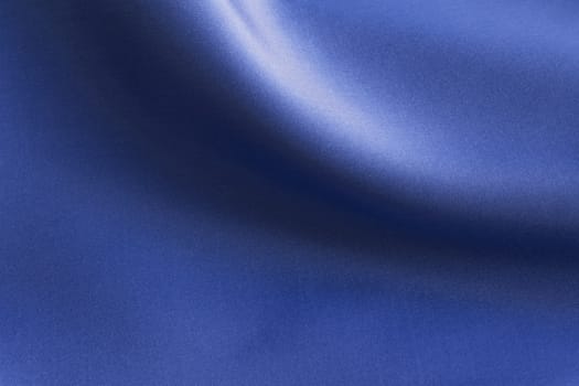 Shiny Blue silky fabric folds background texture
