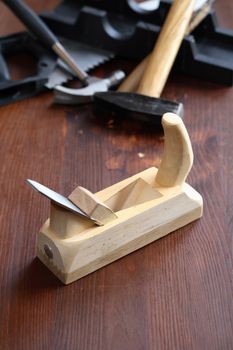 Set of carpenter tools on wooden workbench