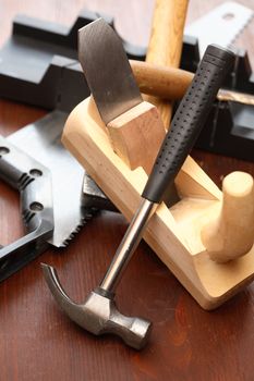 Set of carpenter tools on wooden workbench