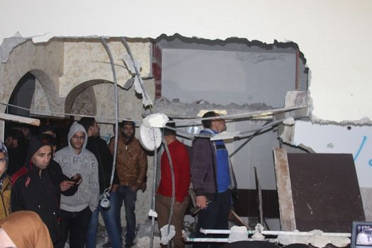 WEST BANK, Hebron: Relatives inspect the heavily damaged interior of the home of Ihab Maswada, a Palestinian man accused of stabbing an Israeli man, Genadi Kaufman,  after it was destroyed by Israeli authorities in Hebron, West Bank, on March 31, 2016. Kaufman was murdered near the Cave of the Patriarchs in Hebron on December 7, 2015. Maswada was shot dead by security forces at the scene.