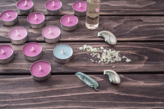 Spa concept. lavender oil,candles, aromatic salt on wooden background