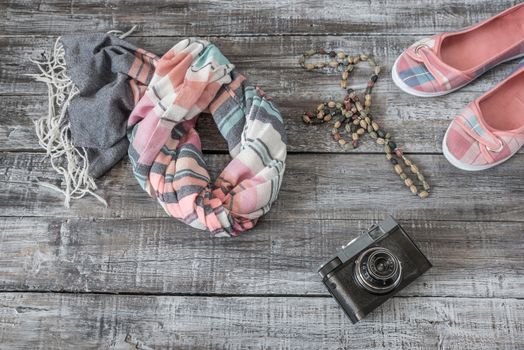 Vintage still life of random objects of modern woman on wooden board