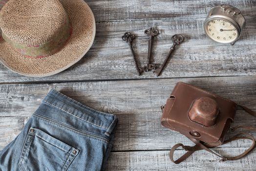 Vintage still life of random objects of modern woman on wooden board