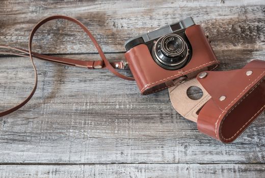 Vintage  old camera on wood background.Top view