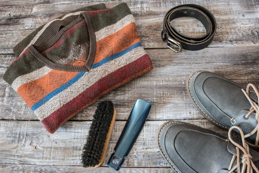 Travel, vacation concept of random men's objects on wooden background