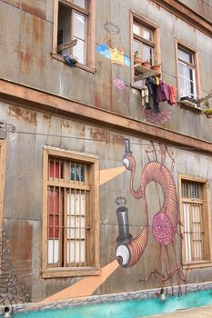 Colourful murals decorating the walls of buildings in the historic port city of Valparaiso in Chile.