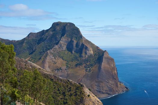 Panoramic view of the coast of volcanic landscape of Robinson Crusoe Island, one of three main islands making up the Juan Fernandez Islands some 400 miles off the coast of Chile.