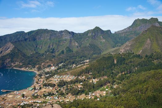 Panoramic view of Cumberland Bay and the town of San Juan Bautista on Robinson Crusoe Island, one of three main islands making up the Juan Fernandez Islands some 400 miles off the coast of Chile.