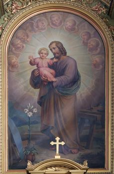 Saint Joseph holding child Jesus altarpiece in the Basilica of the Sacred Heart of Jesus in Zagreb, Croatia