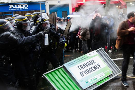 FRANCE, Paris: Police officers pepper spray protesters as thousands march against the French government's planned labor law reforms on March 31, 2016 in Paris. France faced fresh protests over labour reforms just a day after the beleaguered government of 