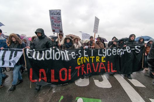 FRANCE, Marseille: Protesters  march holding a banner during a demonstration against the French government's planned labour law reforms on March 31, 2016 in Paris. France faced fresh protests over labour reforms just a day after the beleaguered government of President Francois Hollande was forced into an embarrassing U-turn over constitutional changes.