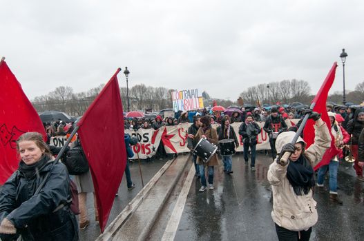 FRANCE, Marseille: Protesters  march holding a banner during a demonstration against the French government's planned labour law reforms on March 31, 2016 in Paris. France faced fresh protests over labour reforms just a day after the beleaguered government of President Francois Hollande was forced into an embarrassing U-turn over constitutional changes.