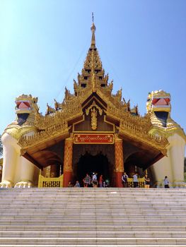 YANGON,MYANMAR-April 15 : Large lion guardians statue at entrance to Shwedagon Pagoda on April 15,2013 in Yangon city,Myanmar. Giant half lion, half griffin creatures which guard most entrances to pagodas in Myanmar.