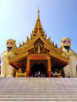 YANGON,MYANMAR-April 15 : Large lion guardians statue at entrance to Shwedagon Pagoda on April 15,2013 in Yangon city,Myanmar. Giant half lion, half griffin creatures which guard most entrances to pagodas in Myanmar.