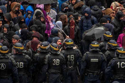 FRANCE, Paris: Protesters clash with French riot police officers as thousands demonstrate against the French government's planned labour law reforms on March 31, 2016 in Paris. France faced fresh protests over labour reforms just a day after the beleaguered government of President Francois Hollande was forced into an embarrassing U-turn over constitutional changes. 