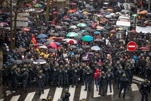 FRANCE, Paris: Protesters clash with French riot police officers as thousands demonstrate against the French government's planned labour law reforms on March 31, 2016 in Paris. France faced fresh protests over labour reforms just a day after the beleaguered government of President Francois Hollande was forced into an embarrassing U-turn over constitutional changes. 