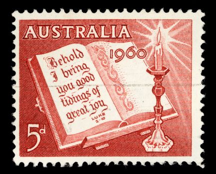 Stamp printed in Australia from the Christmas issue shows Open Bible and Candle, circa 1960.