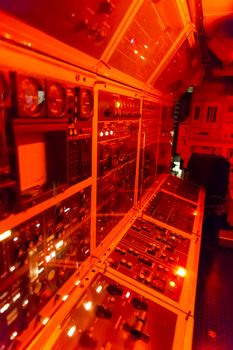 control room closeup , red light modern electronic technology background