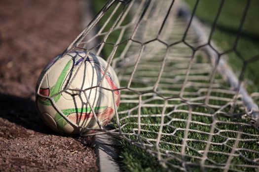 football ball scored into the net gate