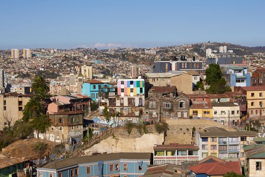 Colourfully decorated houses crowd the hillsides of the historic port city of Valparaiso in Chile.