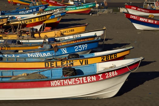 Colourful fishing boats on the beach in the small fishing village of Curanipe in the Maule Region of Chile.