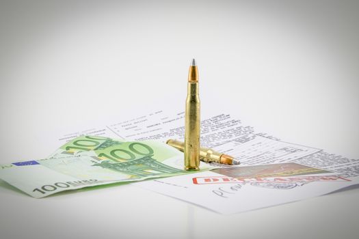 composition with bullets, money and documents of the investigation