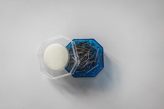 A top view shot of a box of needles.
