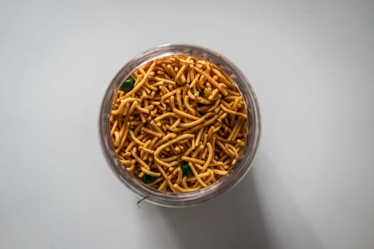 A top view shot of Malaysian traditional crispy snack in a glass container