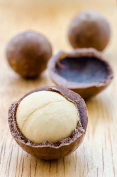 macadamia nuts on wooden background