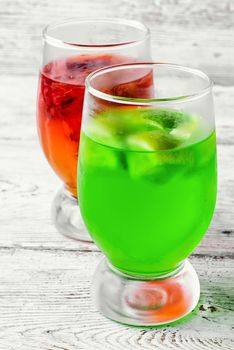 glass of sweet milk and honey drinks with kiwi and oranges
