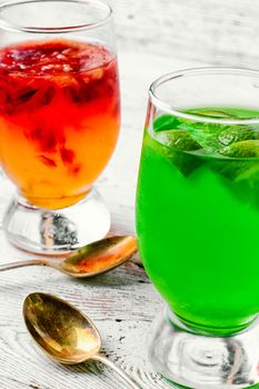 glass of sweet milk and honey drinks with kiwi and oranges