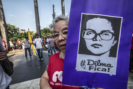 BRAZIL, Sao Paulo: A protester holds a banner with the effigy of President Dilma Rousseff as hundreds protest in support of Brazil's President Dilma Rousseff and former President Luiz Inacio Lula da Silva at the Se Square, in Sao Paulo, southeastern Brazil, on March 31, 2016. Rousseff is currently facing impeachment proceedings as her government faces a stalling national economy and multiple corruption scandals. 