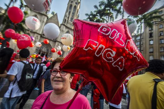 BRAZIL, Sao Paulo: A protester holds a balloon reading Dilma Fica (Stay Dilma in english) as hundreds protest in support of Brazil's President Dilma Rousseff and former President Luiz Inacio Lula da Silva at the Se Square, in Sao Paulo, southeastern Brazil, on March 31, 2016. Rousseff is currently facing impeachment proceedings as her government faces a stalling national economy and multiple corruption scandals. 