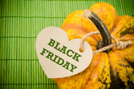 Black Friday price tag on a pumpkin green mat bamboo.