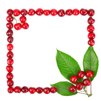 frame made of cherries and green leaves isolated on white background