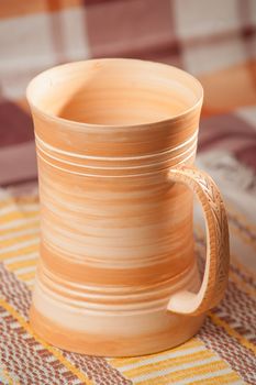 Traditional handcrafted mug on multycolor background. High resolution