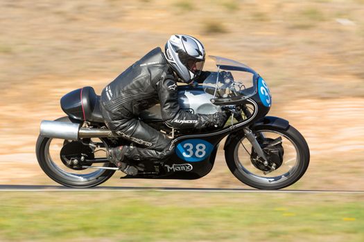 BROADFORD, VICTORIA/AUSTRALIA - APRIL 1, 2016: Classic bikes practice at Broadford Racetrack before the 2016 Shannons Victorian Historic Road Racing Championship.