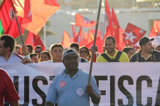 BRAZIL, Brasília : Unionists and Worker's Party (PT) supporters demonstrate in support of President Dilma Rousseff and former President Luiz Inacio Lula da Silva in Brasilia on March 31, 2016. Brazil's Supreme Court on Thursday removed a politically explosive case against former president Luiz Lula Inacio da Silva from a crusading corruption judge. Judges voted to put Lula's case under the jurisdiction of the Supreme Court and not federal Judge Sergio Moro. Lula is accused of money laundering and concealing property in connection with a huge probe led by Moro into state oil company Petrobras. 