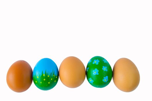 Easter eggs in a roEaster eggs in a row on a white backgroundw