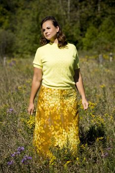 young woman wearing fall fashion outfit outdoors