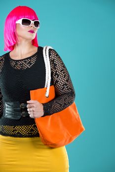 woman with pink hair wearing colorful stylish outfit