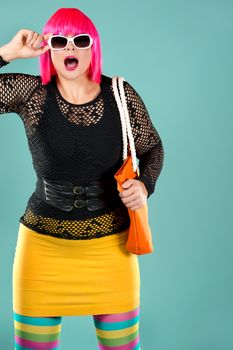 woman with pink hair wearing colorful stylish outfit