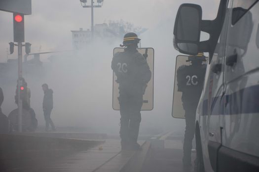 FRANCE, Toulouse:  French riot police officers surround protesters during a demonstration against the French government's planned labour law reforms on March 31, 2016 in Toulouse, southern France. France faced fresh protests over labour reforms just a day after the beleaguered government of President Francois Hollande was forced into an embarrassing U-turn over constitutional changes. 