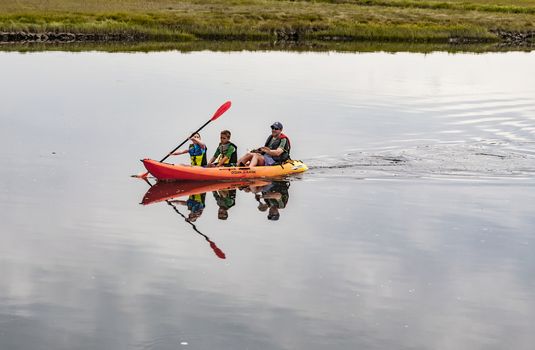 WELLS, ME - AUGUST 21: Family kayaking in winter on the coast of Maine on August 21, 2014 in Wells, Maine USA