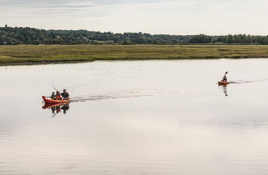 WELLS, ME - AUGUST 21: Family kayaking in winter on the coast of Maine on August 21, 2014 in Wells, Maine USA