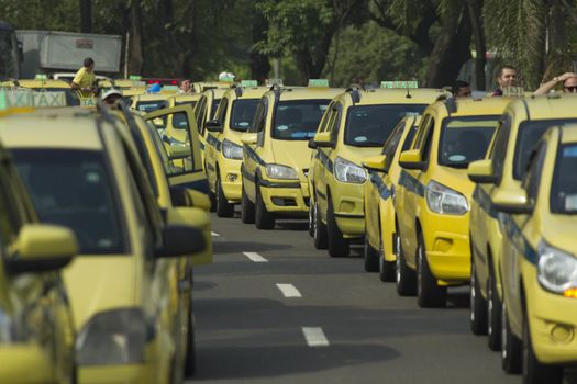 BRAZIL, Rio de Janeiro: Hundreds of taxi drivers parked, blocking the street in Rio de Janeiro, Brazil on April 1, 2016. Taxi drivers are outraged that Uber, which does not have the authorization to operate in Rio, continues to do so under a court injunction. The demonstrators called for Uber to leave Brazil.